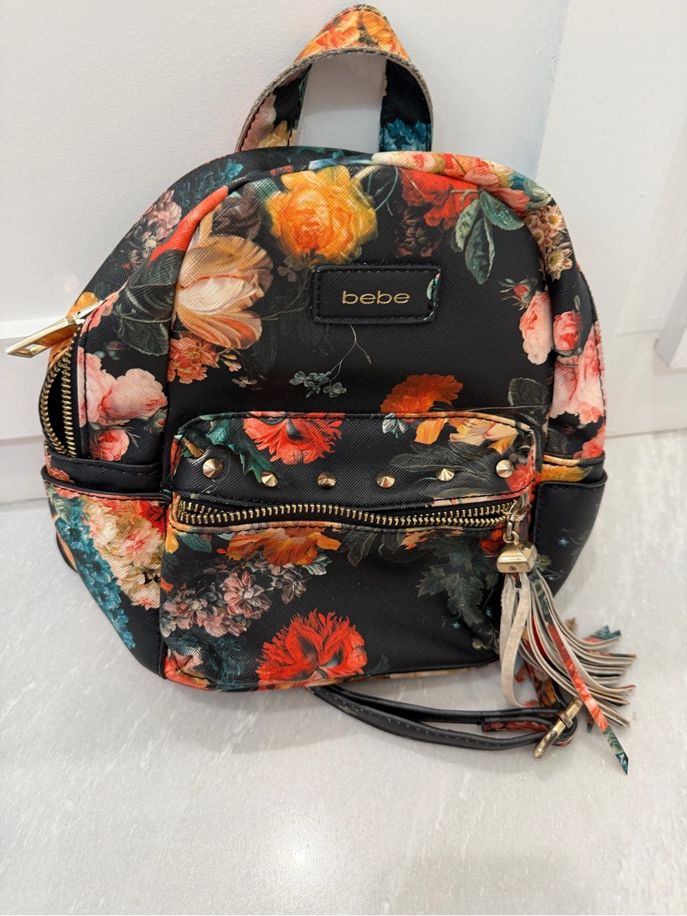bebe Black Floral Mini Backpack Purse with Multicolor Roses and Tassel
